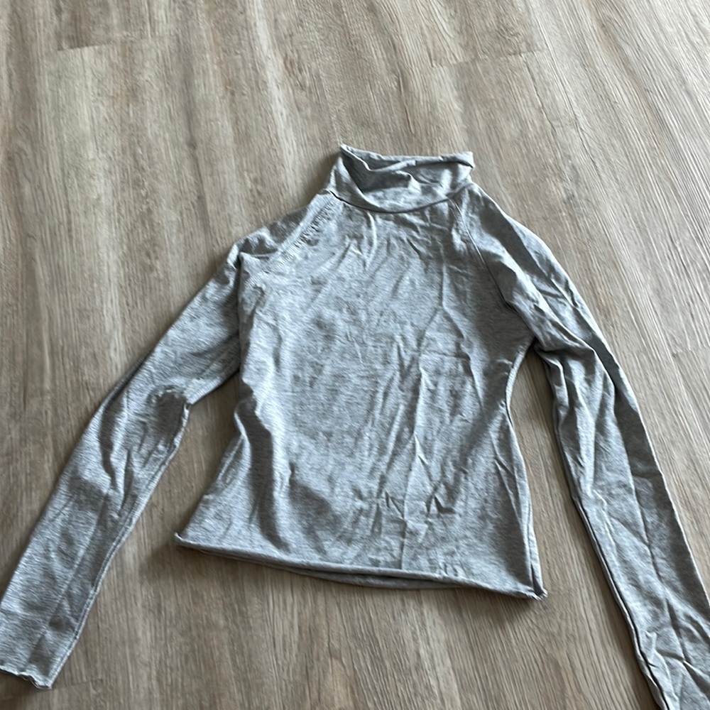 Long sleeve, open back turtle neck top